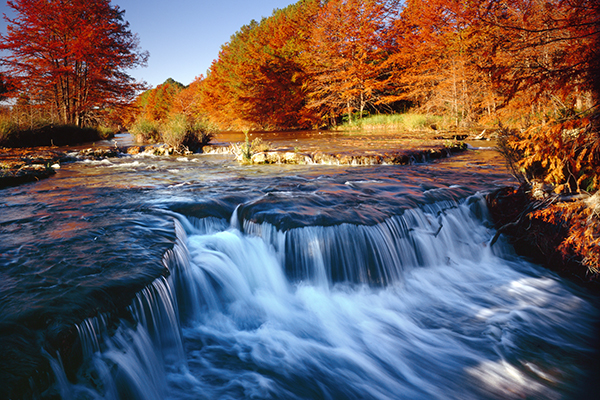 waterfall with changing leaves