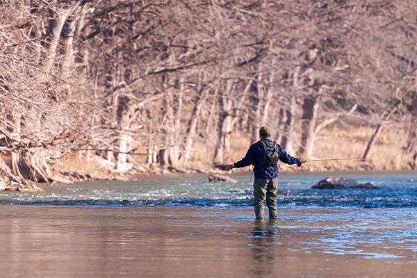 person fishing on a river connected to teh aquifer