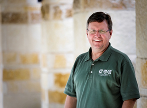 man in an EAA green polo shirt