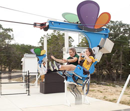 Two kids enjoying a ride on Morgans Wonderland Camp