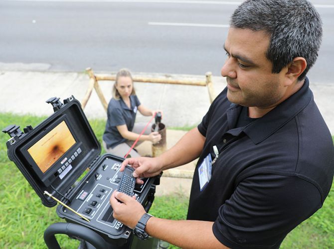 man on computer to check a well