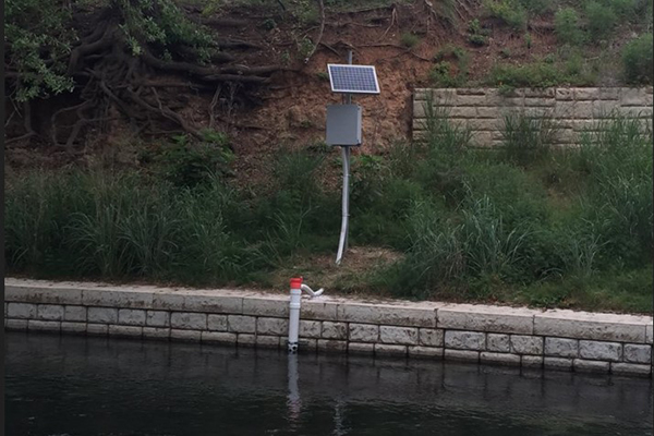 solar powered water quality monitor in a river