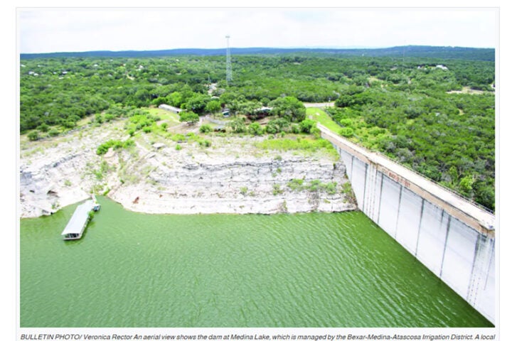 An aerial view shows the dam at Medina Lake